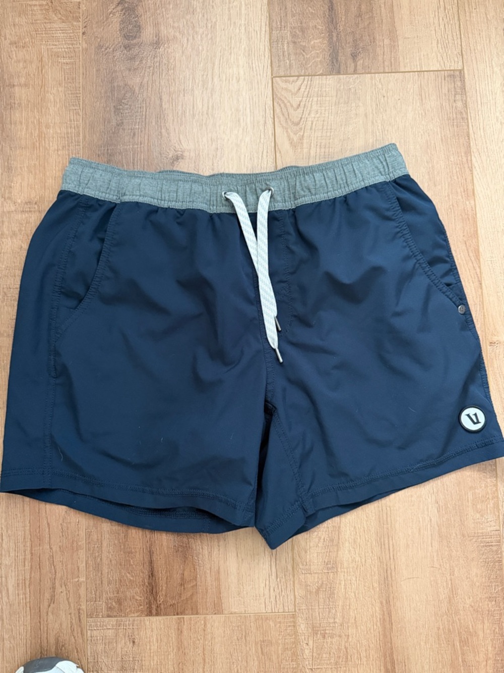 Vuori Kore Navy Shorts 5 inch with Gray Waistband and liner.